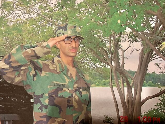 Dr. Loungani saluting in U.S. Army field uniform