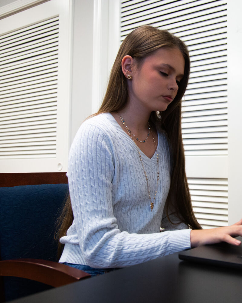 A teenage girl taking a computer-based attention test