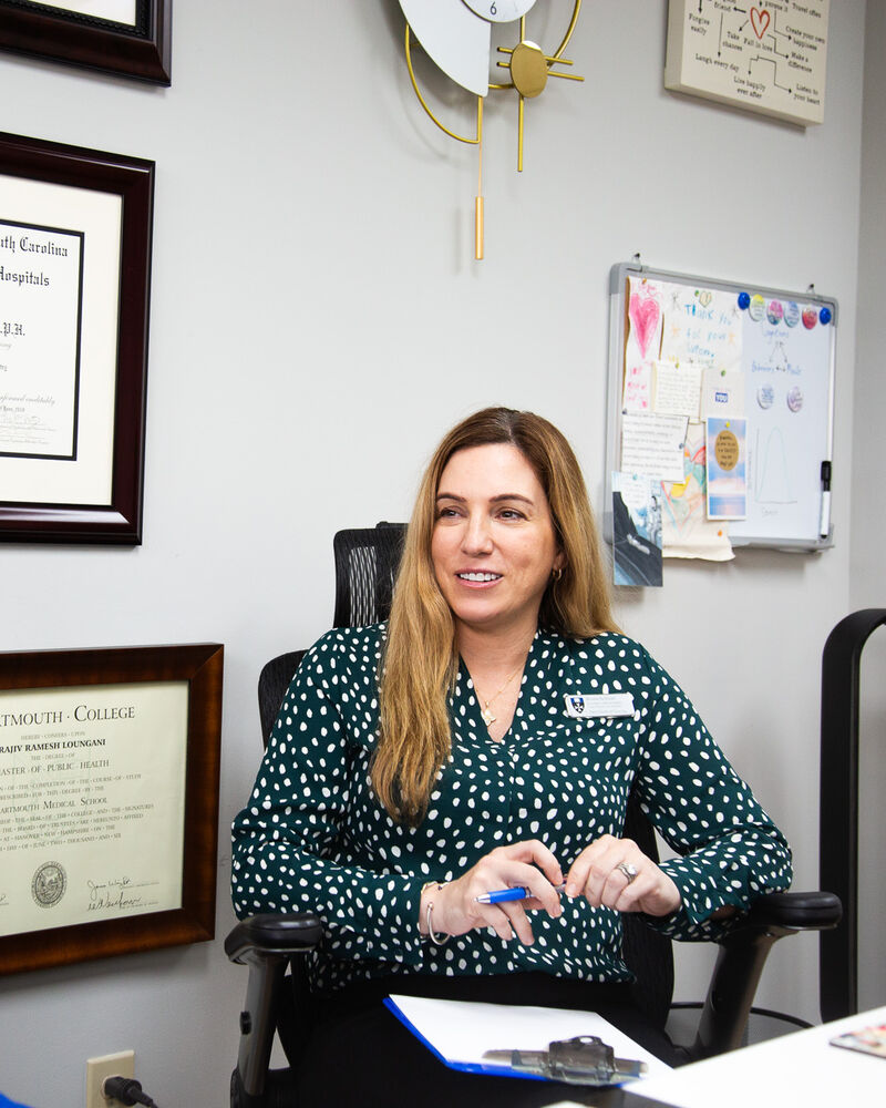 A nurse practitioner at Dr. Loungani's desk during a supervision session